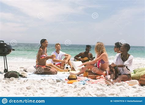 Group Of Friends Relaxing And Sitting On Beach Stock Photo Image Of Beautiful Friendship