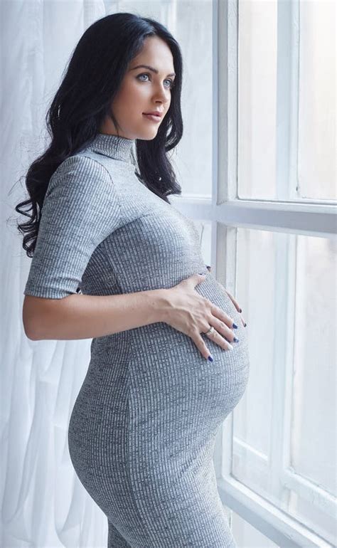 Pregnant Brunette Woman In A Grey Dress Stock Photo Image Of Indoors