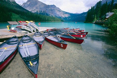 Red Canoes At A Dock Emerald Lake Photograph By George Oze Fine Art