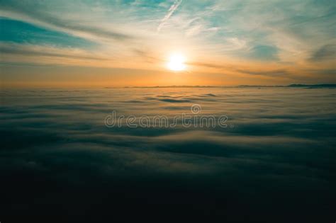 Great View Of The Foggy Sunrise Sky In The Austrian Alps Stock Photo