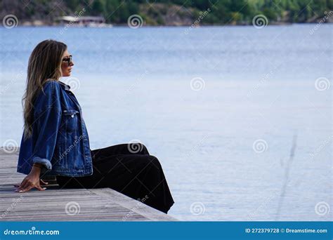 Woman Sitting On Pier Over Sea During Summer Stock Photo Image Of Sitting Lake