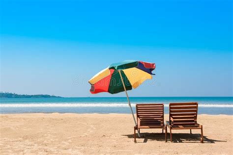 Two Beach Chairs And Umbrella On Tropical Ocean Beach Stock Image