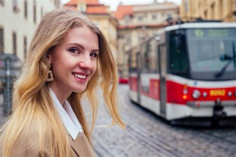 Premium Photo Blonde Woman Stand In Bus Stop And Waiting Trolley In