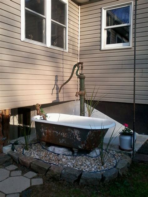 This garden fountain may look substantial and difficult, but all it is is a large pot set in the garden, with a simple bubbler placed inside. My new water fountian project :) | Outdoor bathtub, Garden ...