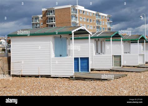Traditional British Beach Huts On The Beach At Bexhill On Sea In East