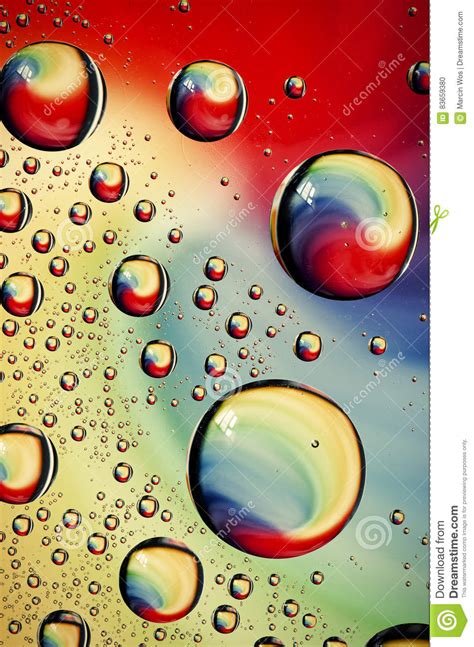 Close Up On Water Drops Background On Rainbow Colors