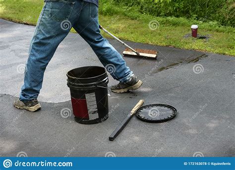 If you have friends who will help you, it is check with your asphalt supplier, as many will take the old asphalt for free, though some do charge a small fee. Maintaning An Asphalt Driveway With Blacktop Sealer Stock Photo - Image of coating, homeowner ...