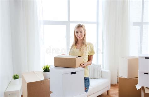 Smiling Young Woman With Cardboard Box At Home Stock Photo Image Of