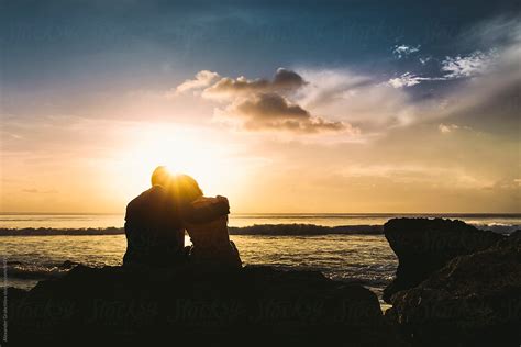 Young Couple At Sunset Beach Stocksy United