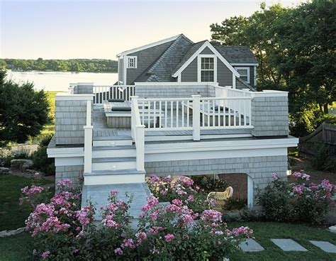 For the past three decades, hutker architects has been servicing the entirety of new england with its distinctive style. Ocean Cottage Roof Deck & Portico - Beach Style - Deck - Boston - by Nashawtuc Architects, Inc.