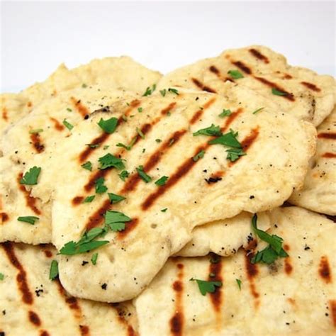 Pull apart the naan into small pieces and roll it to 1/4 inch thick. Garlic Naan - Sweet Pea's Kitchen