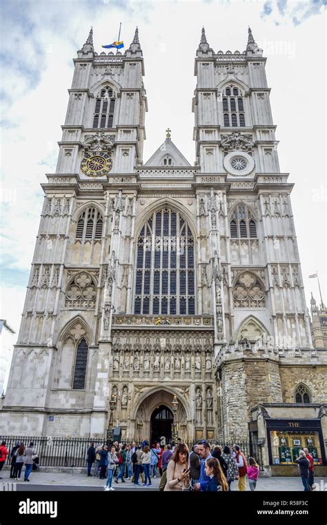 Tourists Entering And Visiting Westminster Abbey A Gothic Abbey Church