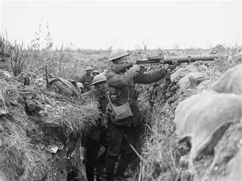 A Lewis Light Machine Gun In Action In A Front Line Trench Near