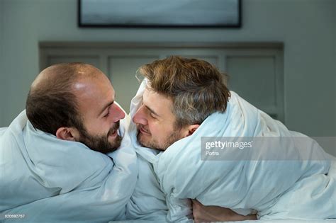 Gay Men About To Kiss On Bed Photo Getty Images