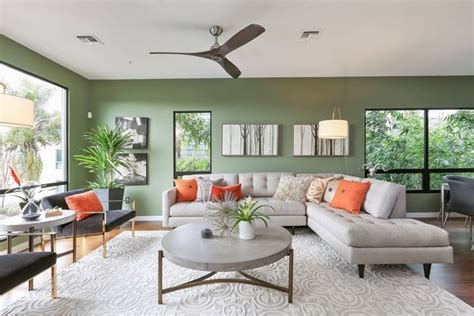 It compliments well the gray green paint of the surrounding walls. Trendy living room color schemes and modern interior ...