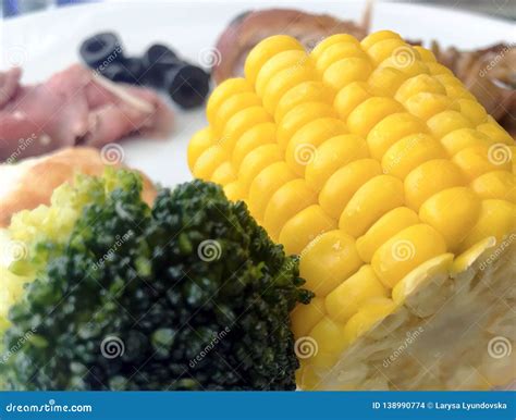 Useful Vegetables Green Broccoli And Yellow Corn On A Plate Proper