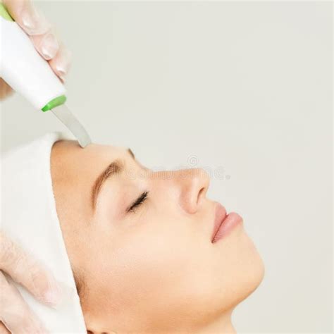 Ultrasonic Skin Equipment Woman Face Cosmetology Treatment Stock Image