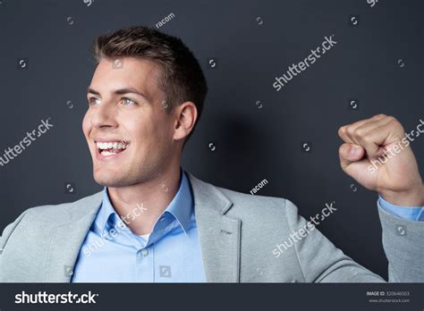 Excited Young Man Cheering Making Fist Stock Photo 320646503 Shutterstock