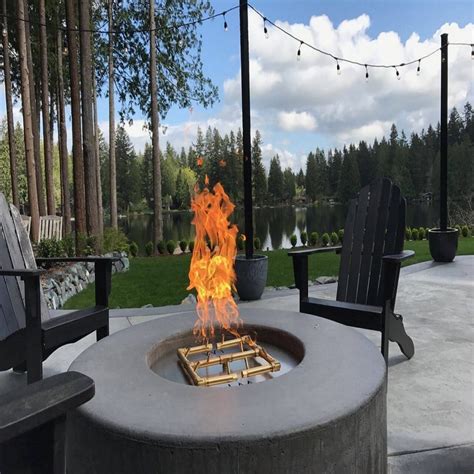 The fire pit below is a failed attempt to burn fireglass with a regular propane burner. Warming Trends - Monroe Fireplace