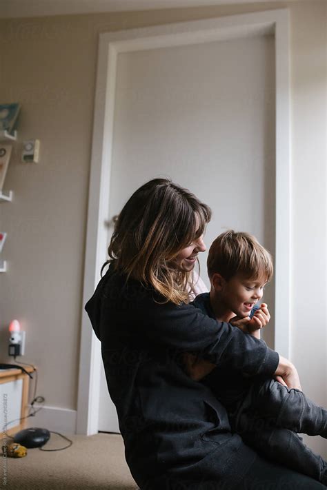 Mom And Son Enjoy A Cuddle Together At Home By Stocksy Contributor