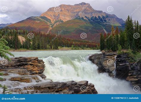 Athabasca Falls And Mount Kerskelin In The Canadian Rockies Jasper