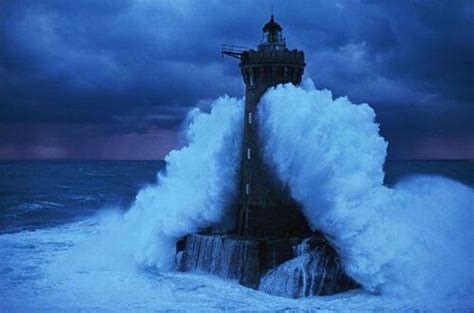 The Lighthouse Of Ar Men In Brittany France Engulfed By A Wave
