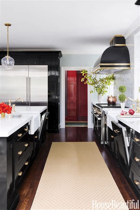 Instead of solid wood, choose this durable mdf board with sliding glass doors. 10 Black Kitchen Cabinet Ideas - Black Cabinetry and Cupboards
