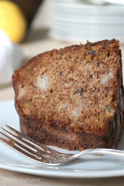 A Piece Of Cake Sitting On Top Of A White Plate With A Fork Next To It