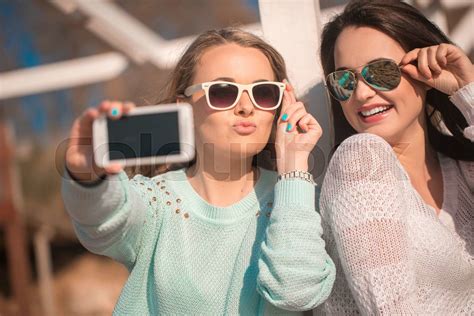Two Girls Taking Selfie Stock Image Colourbox