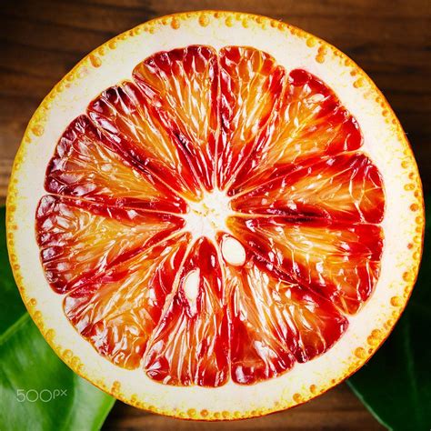Half Of An Orange Citrus Fruit Close Up Ripe Juicy Half Of An Orange