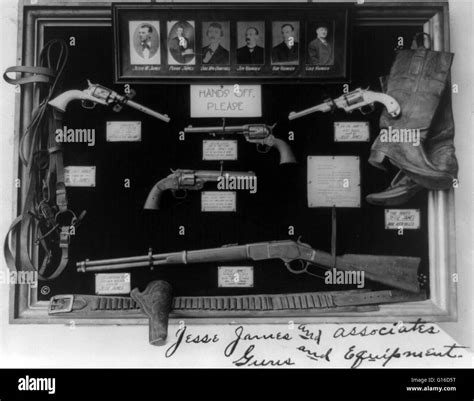 A Display Of Weapons And Other Items Including The Colt 45 That Were