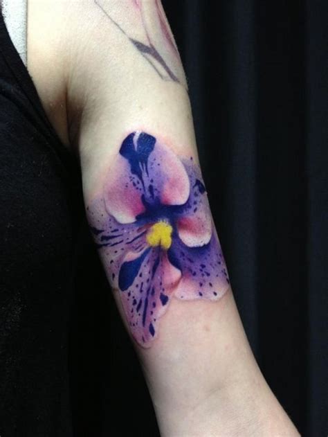 very realistic detailed and colored flower tattoo on arm tattooimages