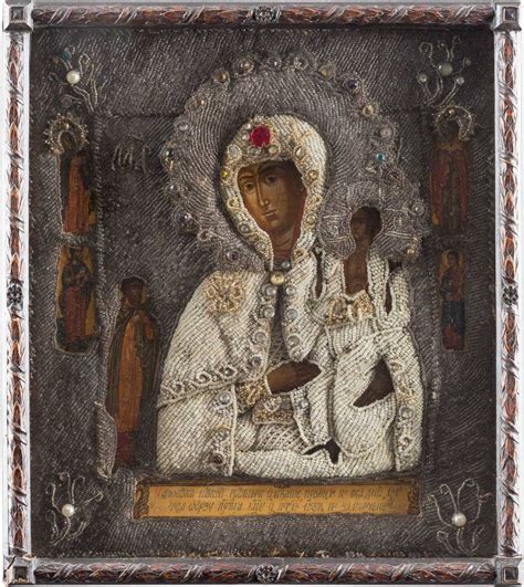 AN ICON SHOWING THE MOTHER OF GOD OF 'UNEXPECTED JOY' WITH EMBROIDERED