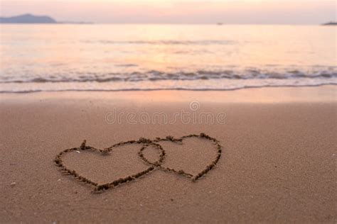 Two Hearts Drawn In The Sand At The Tropical Beach Stock Photo Image
