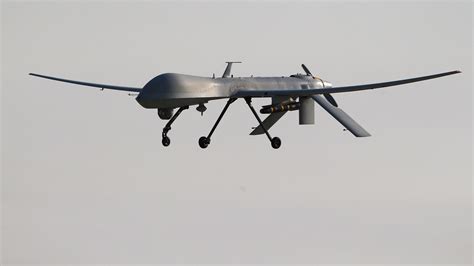 A Us Air Force Mq 1b Predator Unmanned Aerial Vehicle Carrying A