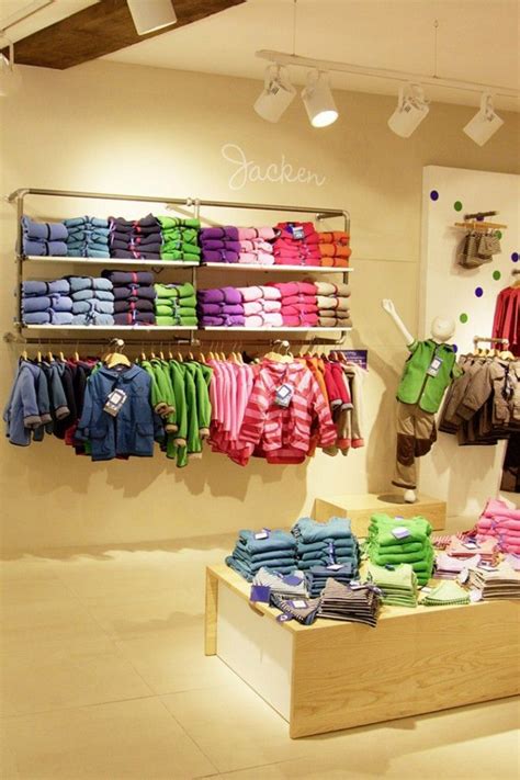 Maybe you would like to learn more about one of these? FINKID children clothing store The Store Designers Erfurt ...
