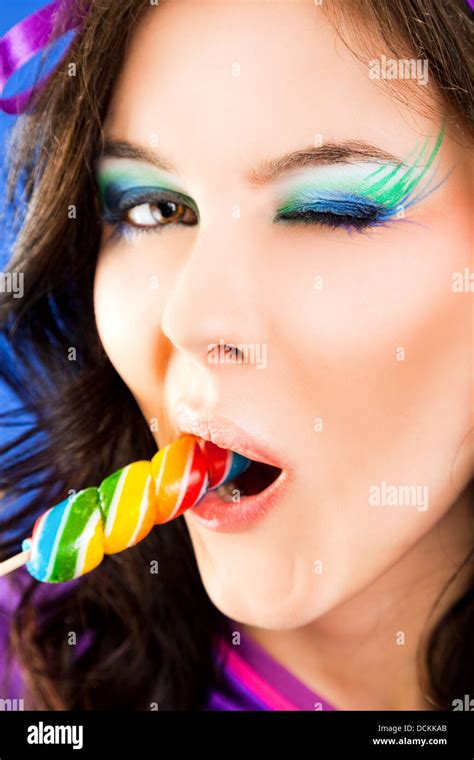 Female Licking Lollipop Blink Stock Photo Alamy