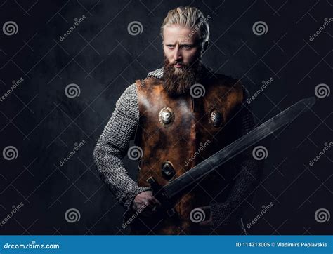 A Man Holds A Sword Stock Image Image Of Blond Armor 114213005