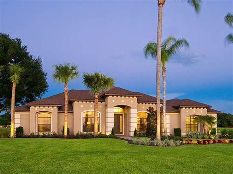 A large waterfront house with boxed hedges and palm trees. 064H-0110: One-Story Mediterranean House Plan; 2761 sf ...