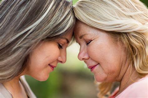 Happy And Loving Mother And Daughter Face To Face Stock Photo