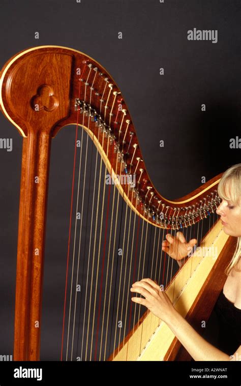 Young Woman Playing Harp Stock Photo Alamy