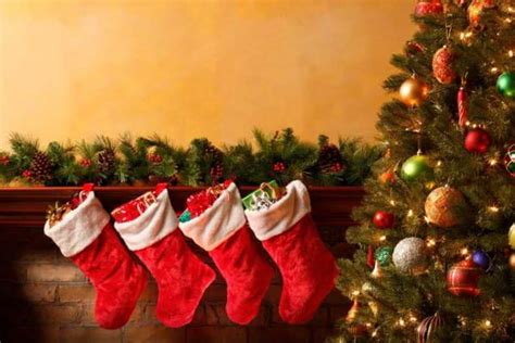Four Christmas Stockings Hanging On Shelf Hd Wallpaper Wallpaper Flare