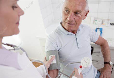 Doctor Patients Taking Blood Pressure Stock Image F0039742