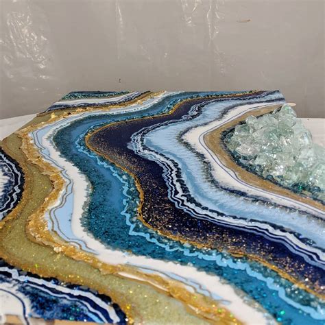 If you are a geode resin artist and need to paint in the fine geode lines in between your resin pours, add extra accents to the sides of your free form geode art, and cover up happy accidents, then you need a good set of paint markers or paint pens. Mediterranean vibes. #artbyloyal #resin #resinart #geode # ...