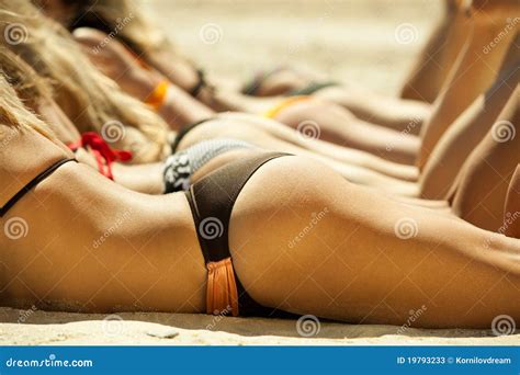 Several Girls In Bikini Lying On Beach Stock Image Image