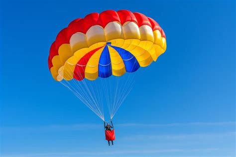 Premium Ai Image Parachutist With Yellow And Blue Parachute Against A