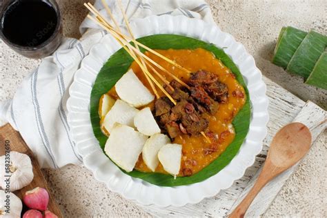sate padang spicy beef satay from padang west sumatra served with spicy curry sauce and rice