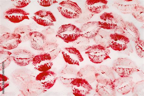 A Lot Of Kissing Marks Made With The Red Lipstick On The White Paper