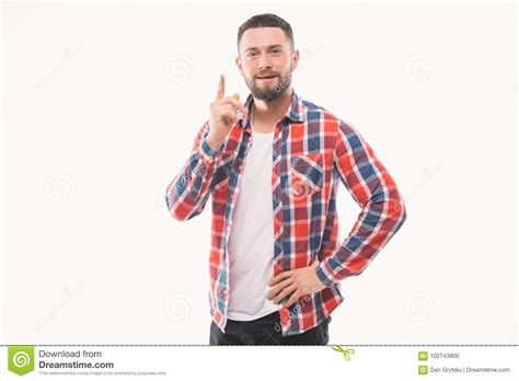 Portrait Of A Smiling Satisfied Man In Plaid Shirt Pointing At Camera Isolated On A White