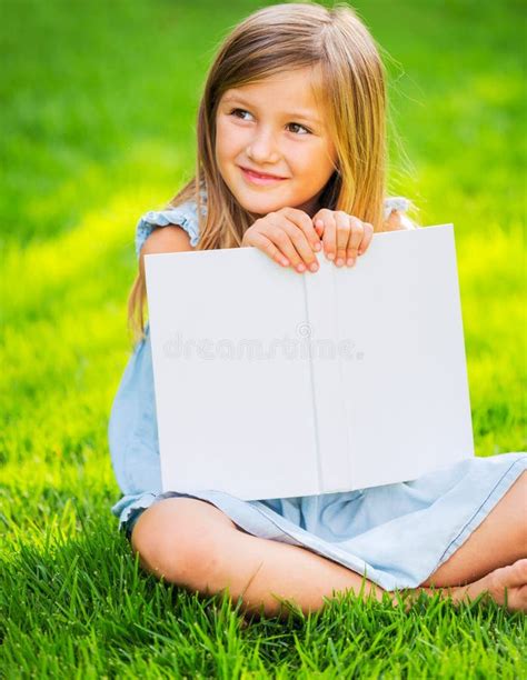Little Girl Reading Book Outside Stock Image Image Of Book Looking